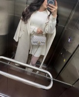 Brunette escort Sophia dressed in all white 